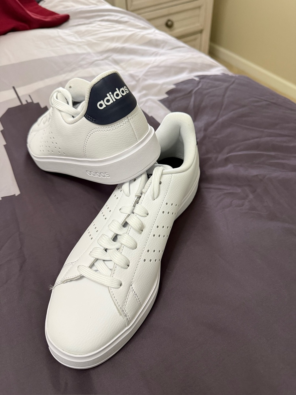 Brand new Women White Sneakers with Navy Heel Tab size 10.